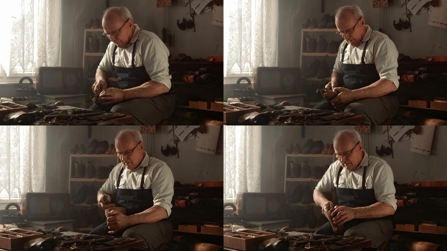 传统鞋匠在老作坊里修鞋