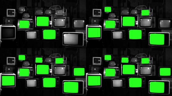 许多有绿色屏幕的电视机