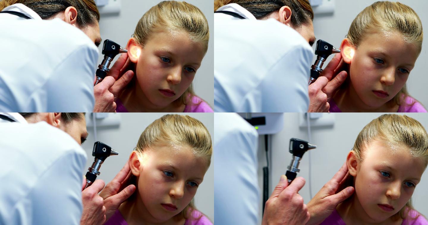女医生用耳镜检查病人耳朵