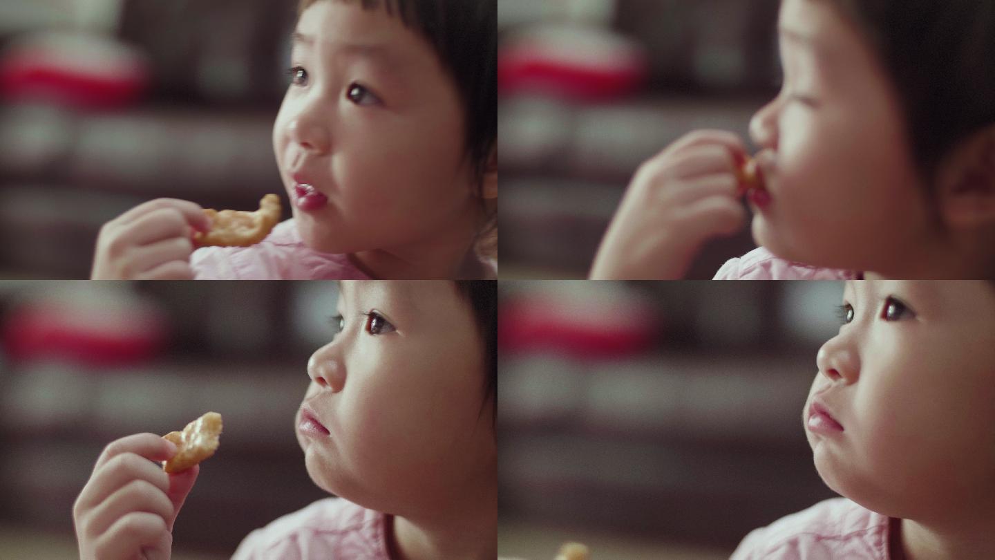 可爱的小女孩在吃饼干