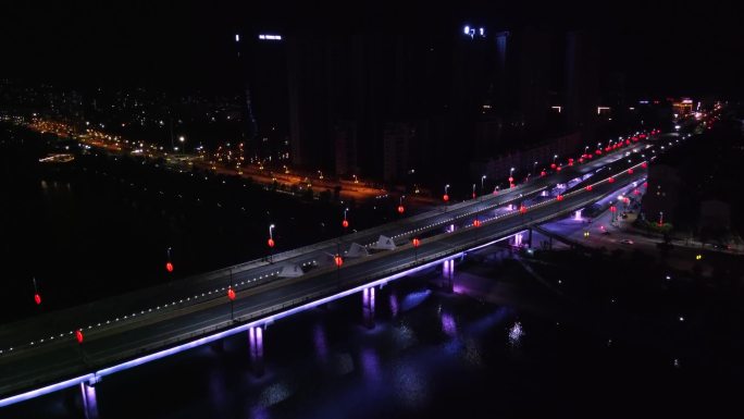 航拍江西吉水县吉阳大桥桥头吉阳路的夜景