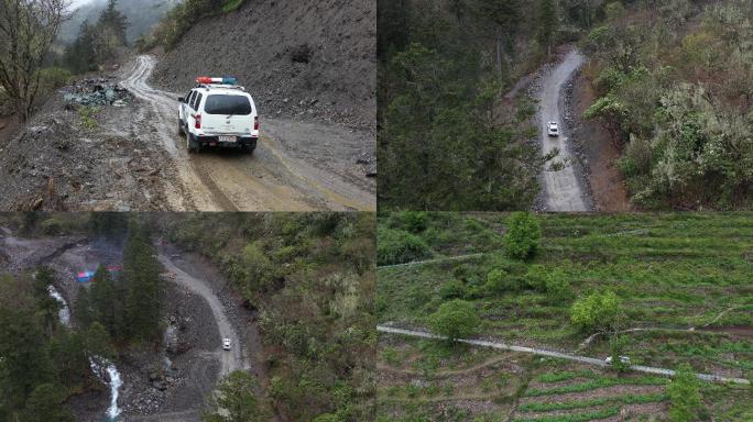 泥泞崎岖山路上行驶的警车