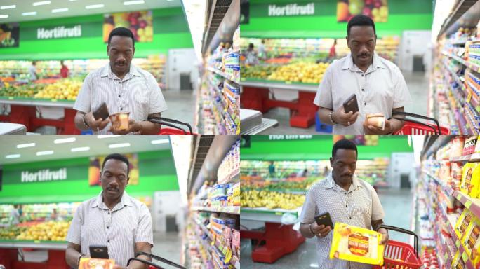 男人在超市购物用智能手机扫描条形码