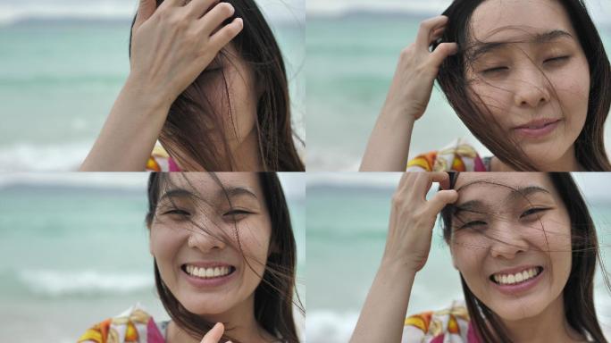 可爱的女人在沙滩上微笑
