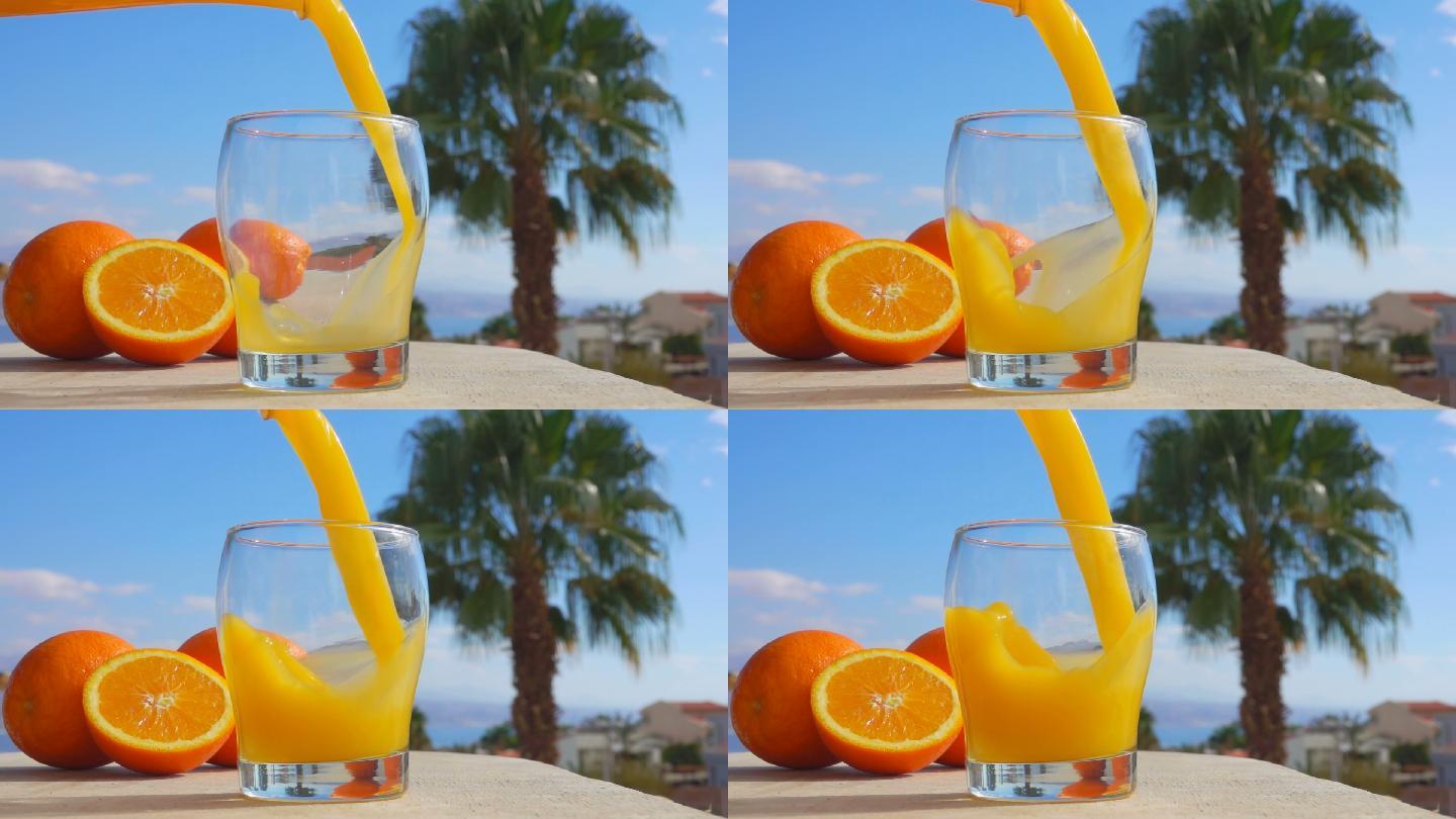 把橙汁倒进杯子里