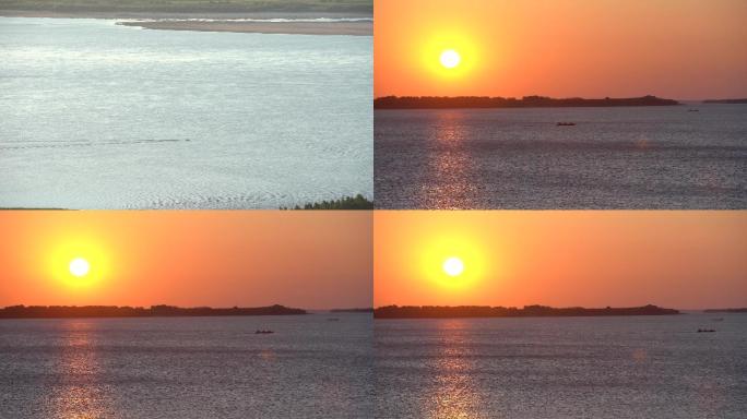 夕阳下皮艇划过湖面