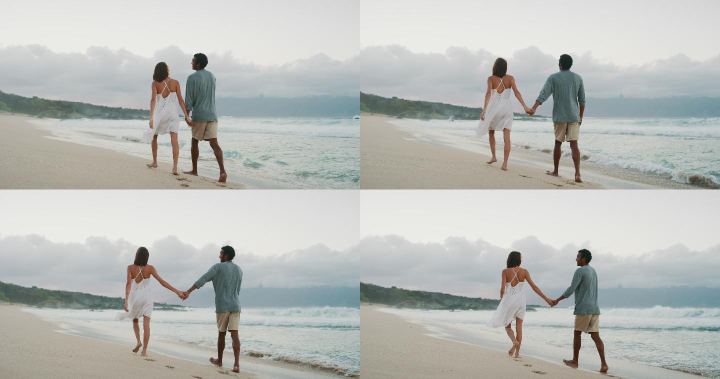 幸福的一对情侣漫步在海滩上