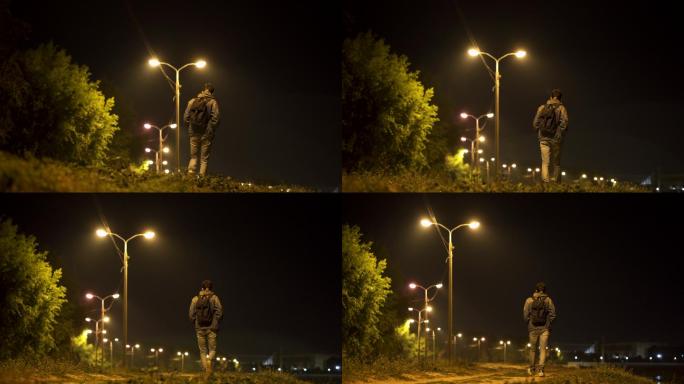 一个年轻人在夜晚散步