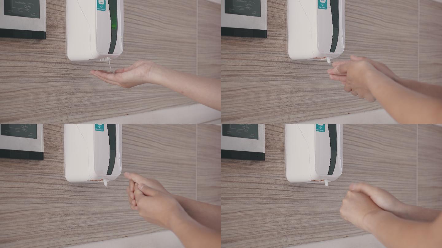 使用自动洗手液洗手的女子
