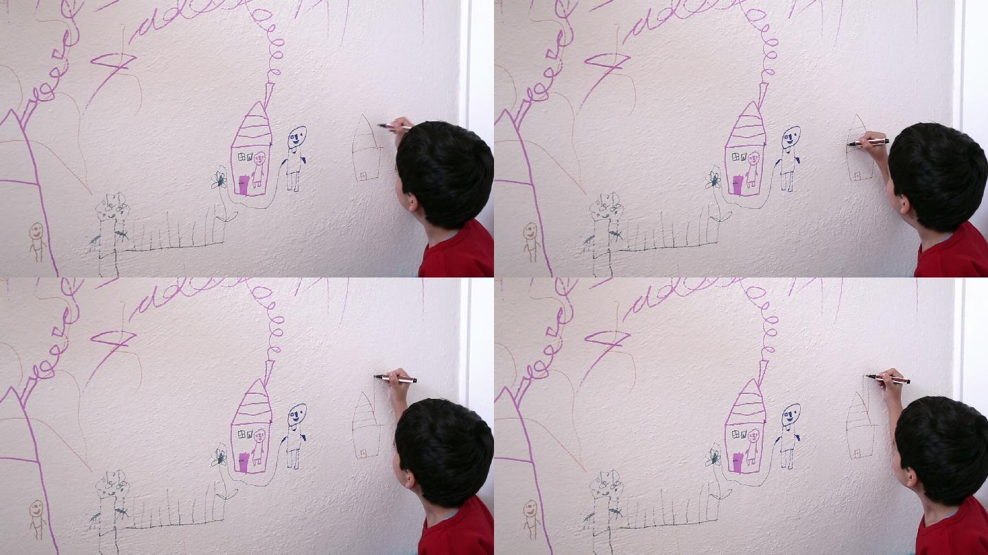 小男孩在墙上画画