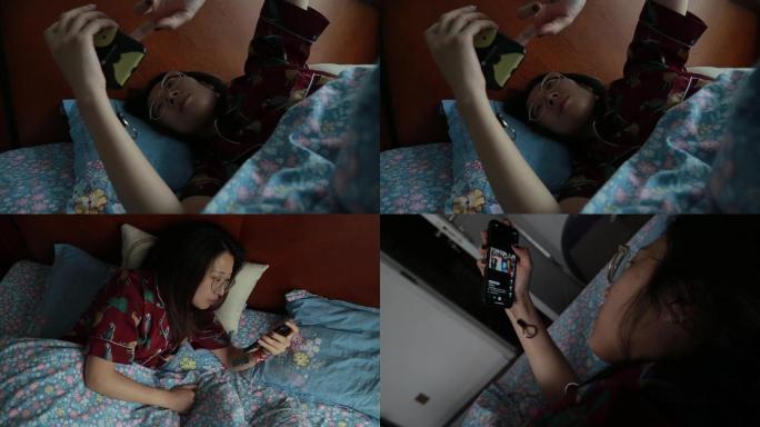 女孩躺床玩手机