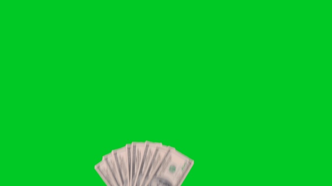 在绿色屏幕上手拿美元。