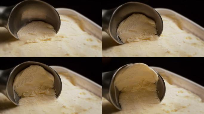 用冰激凌勺舀冰激凌的慢镜头