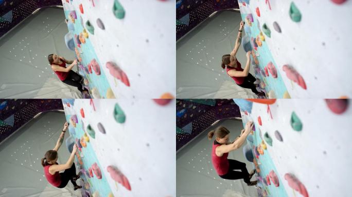 女子在健身房爬垂直墙，攀岩