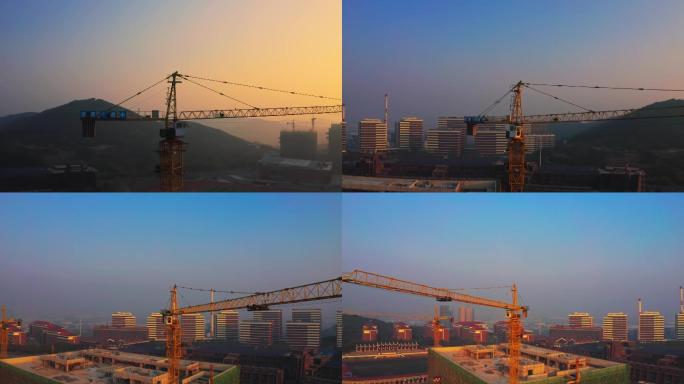 黎明清晨日出施工项目工地航拍塔吊环绕