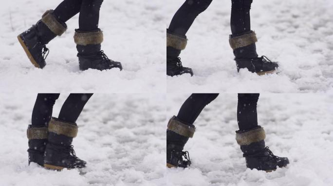 一穿着雪地靴穿行在雪地里的女子
