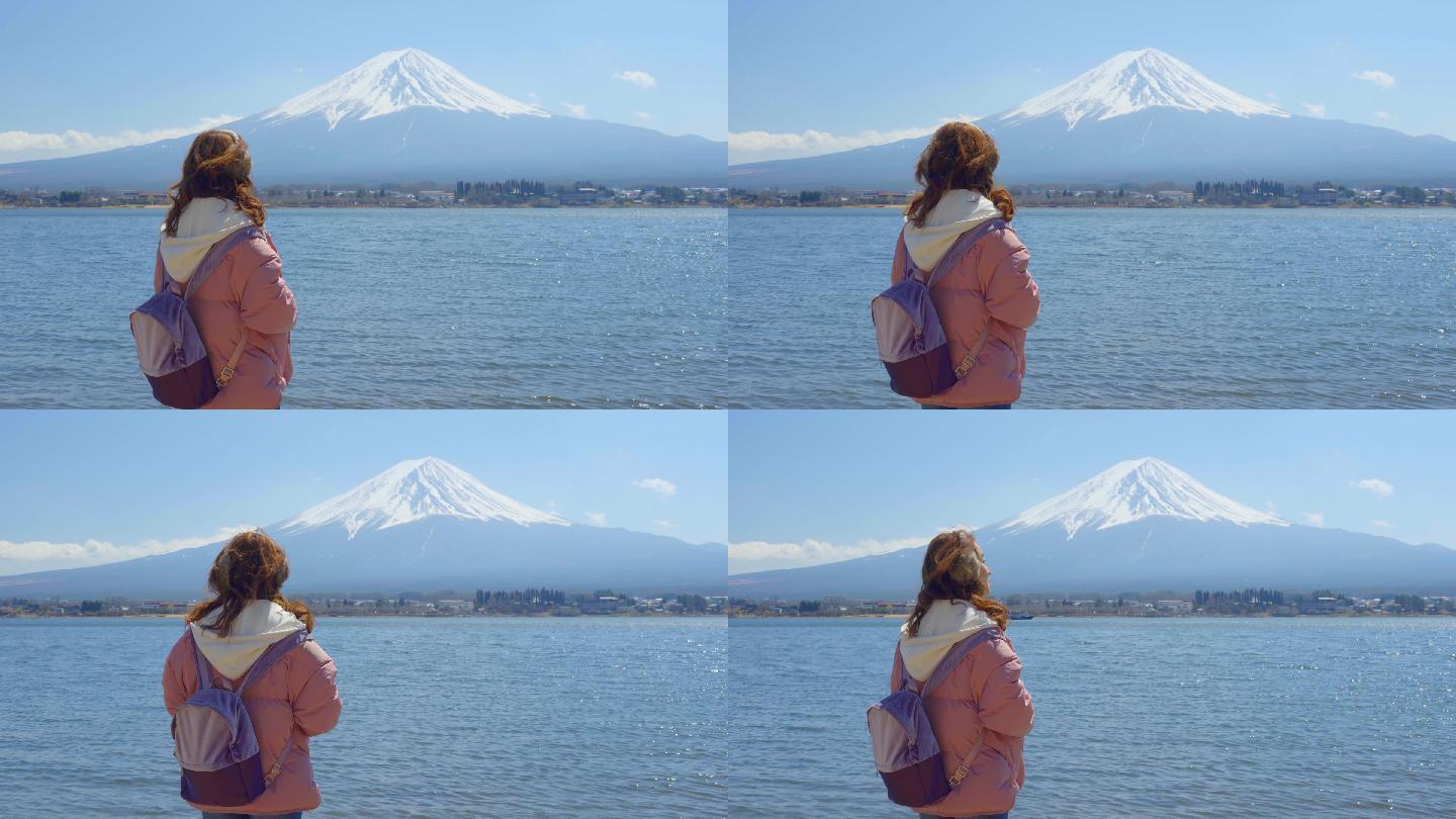 一个女人站在富士山角下