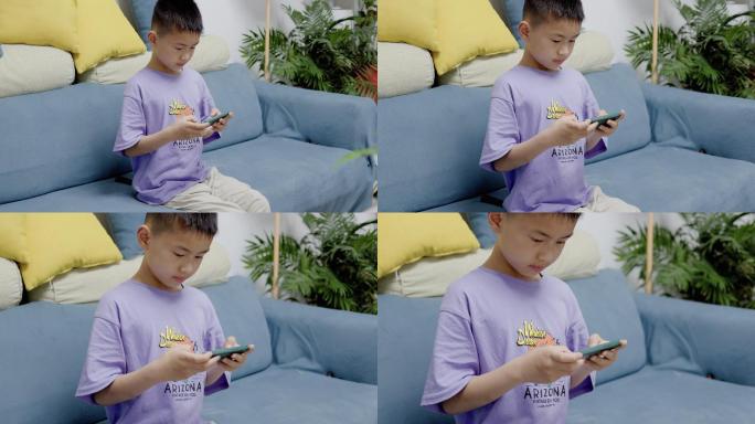4K小孩子在客厅玩手机游戏特写