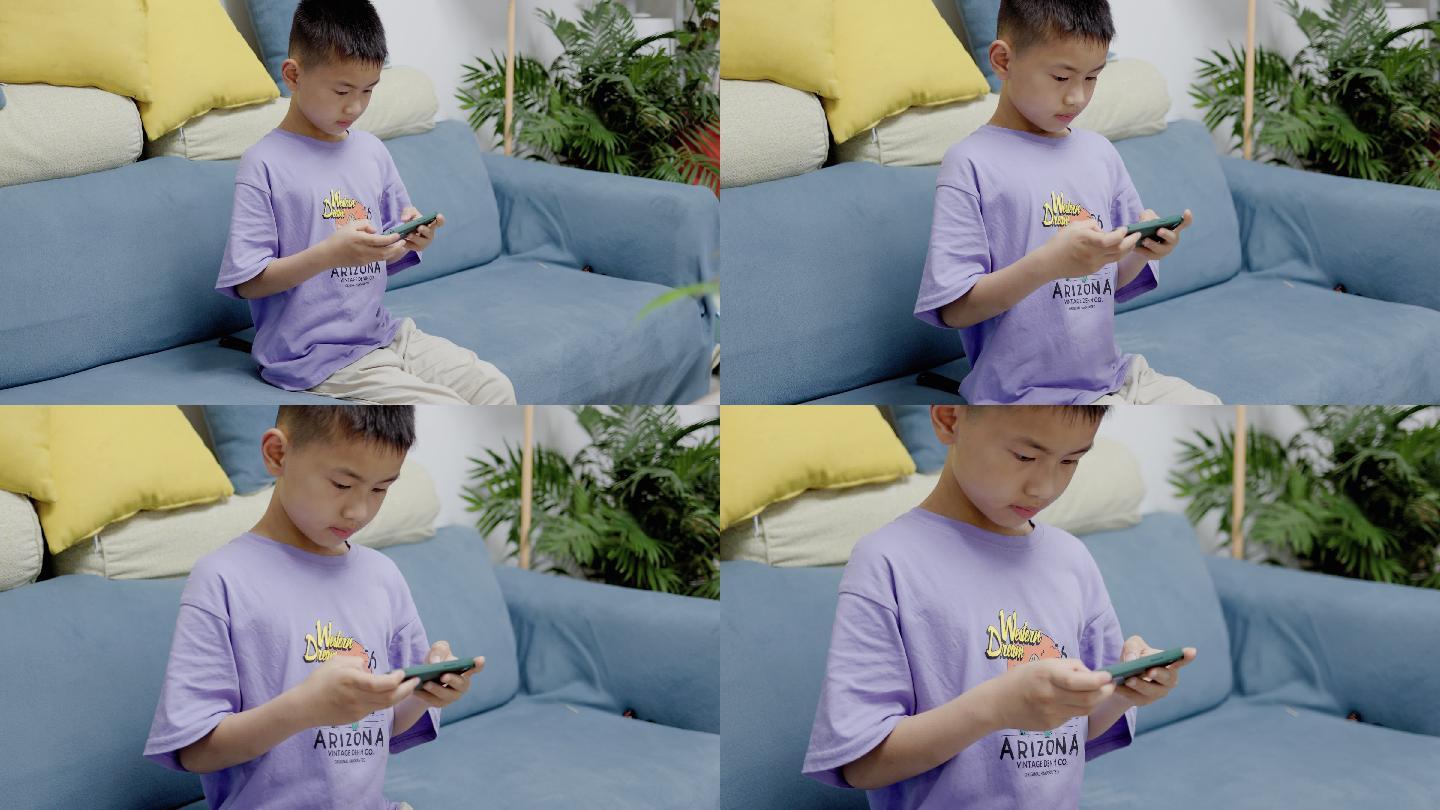 4K小孩子在客厅玩手机游戏特写