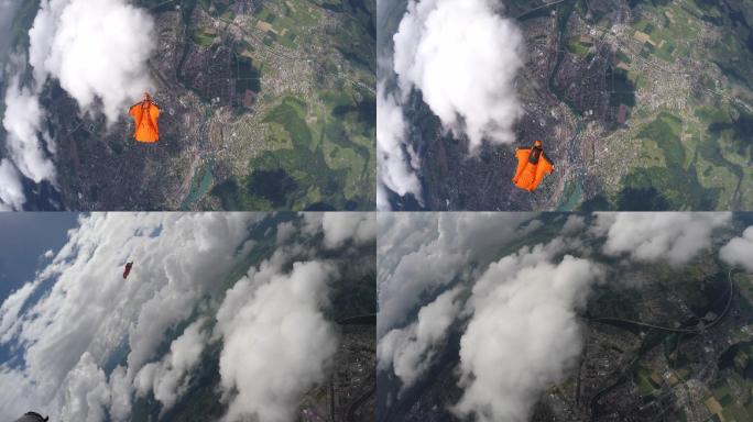 翼装飞行者翱翔在瑞士山区和农田上空