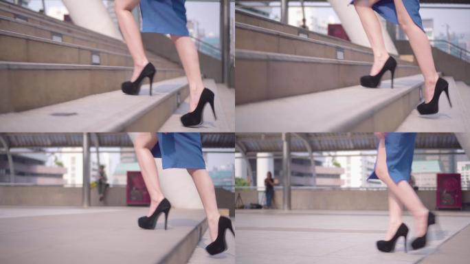 一个穿着高跟鞋的女人走上台阶