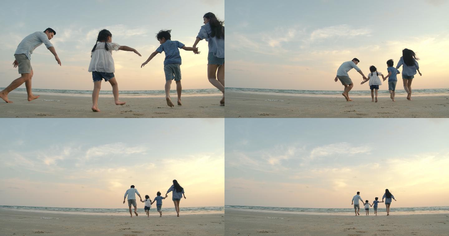 一家人在沙滩上快乐地奔跑