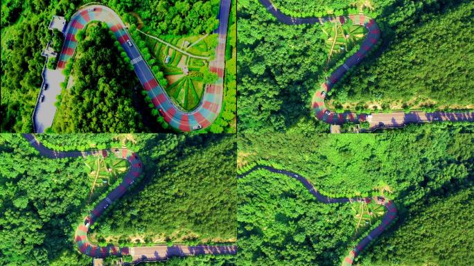 航拍山区森林中蛇形彩色斑纹公路