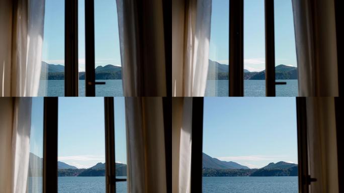 透过打开的窗户可以看到湖景