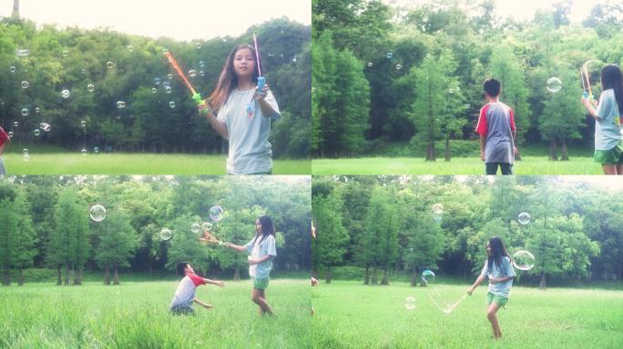 孩子在草地玩耍吹泡泡奔跑4k视频素材