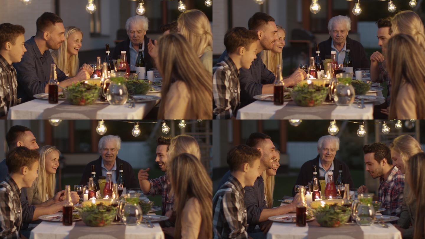 一家人围坐在一张桌子旁吃饭交流