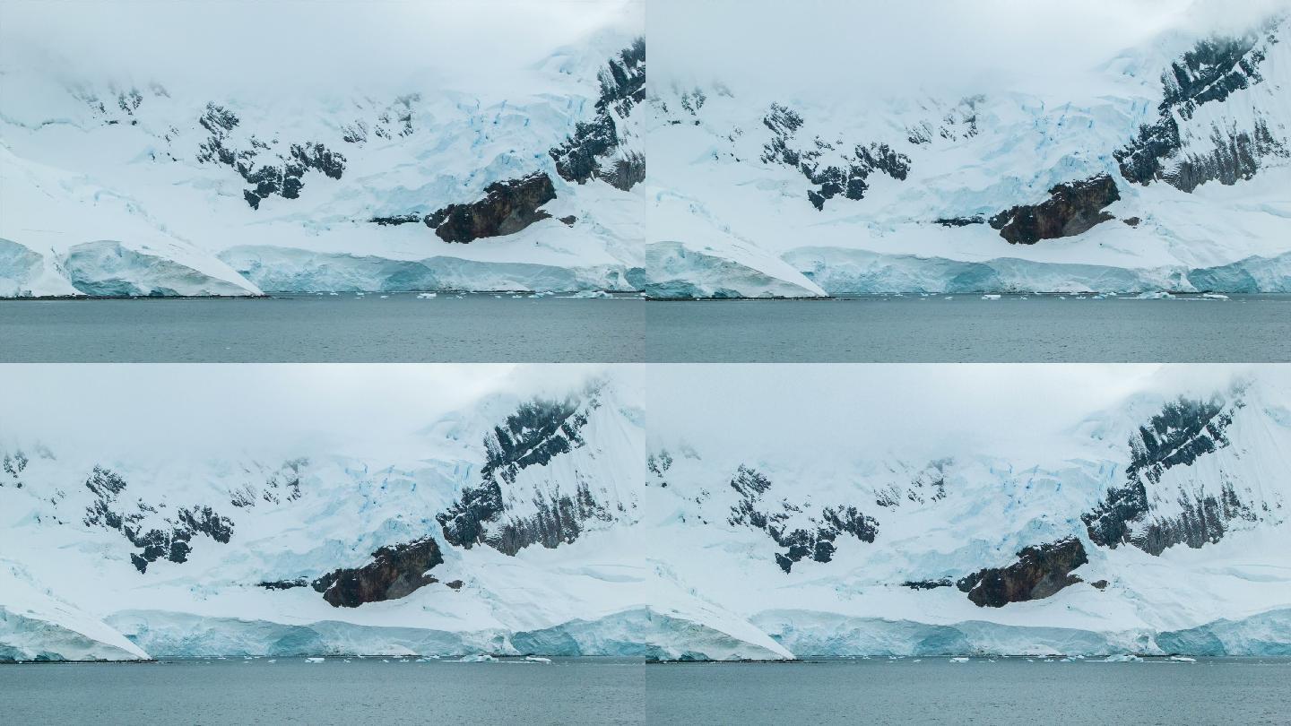 冰冻的南极山脉冰山暖冬雪山融化