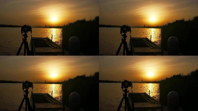 摄影师相机拍摄日出日落
