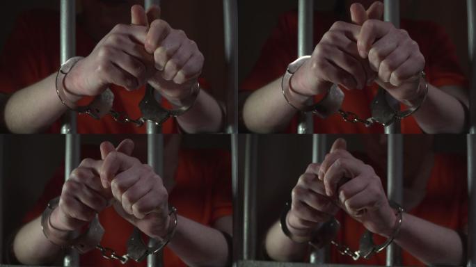 戴着手铐的女囚坐牢受到惩罚罪犯犯罪嫌疑人