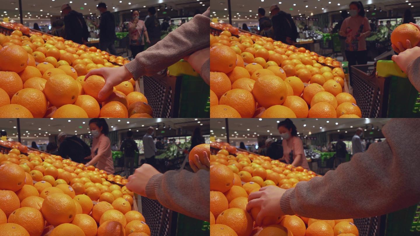 超市人群买水果挑选橙子