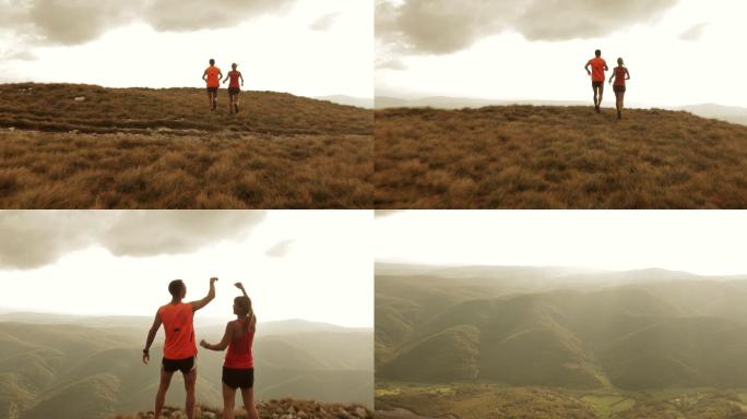 情侣奔向山顶举手的视频