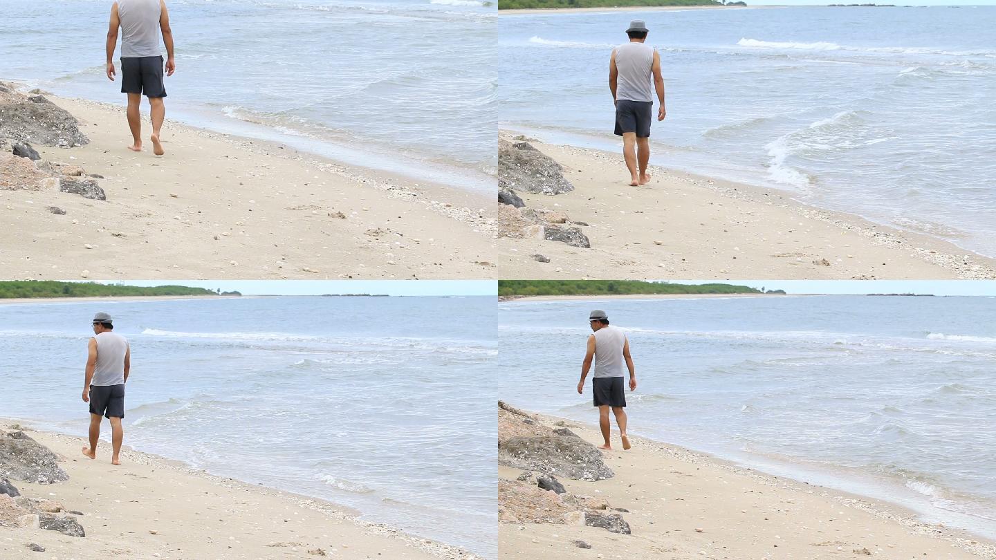 年轻人漫步在海滩上