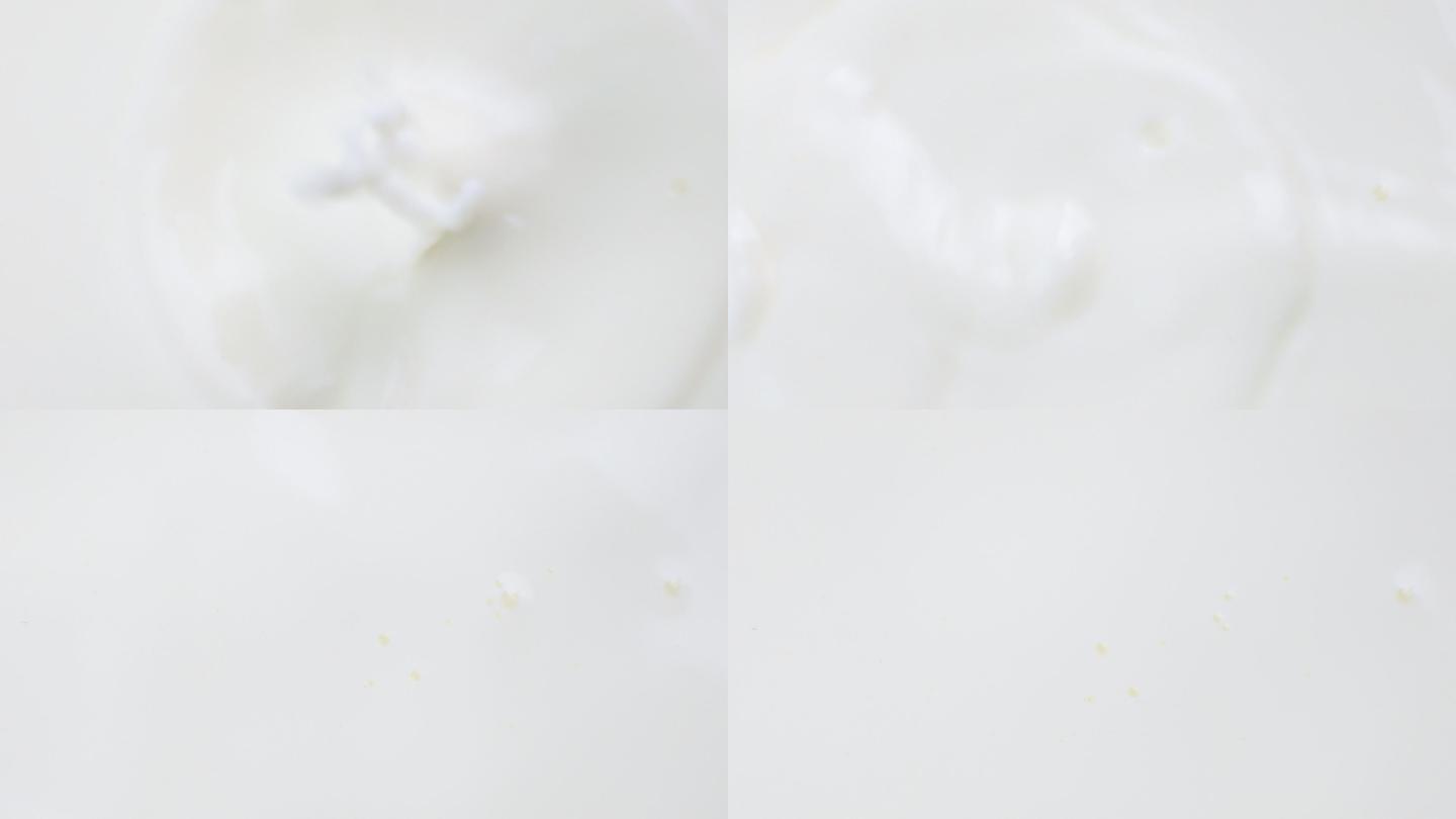 将杏仁倒入鲜奶中的慢镜头。