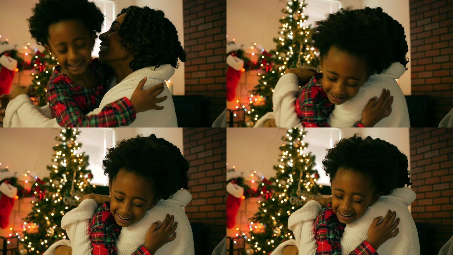小女孩在圣诞节早上拥抱妈妈