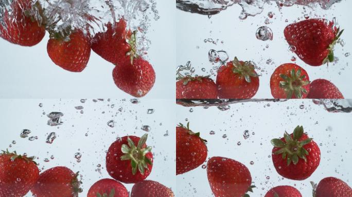 草莓溅入水中的慢镜头