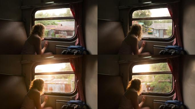 乘火车旅行，旅行中的女人看着窗外。