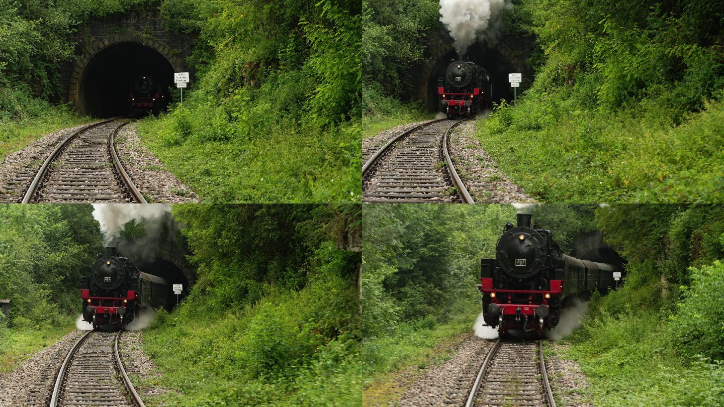 从隧道冒出滚滚浓烟的老式蒸汽火车