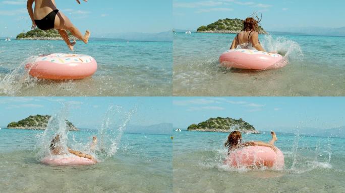 阳光明媚的夏日海洋中，女人跳上充气游泳圈