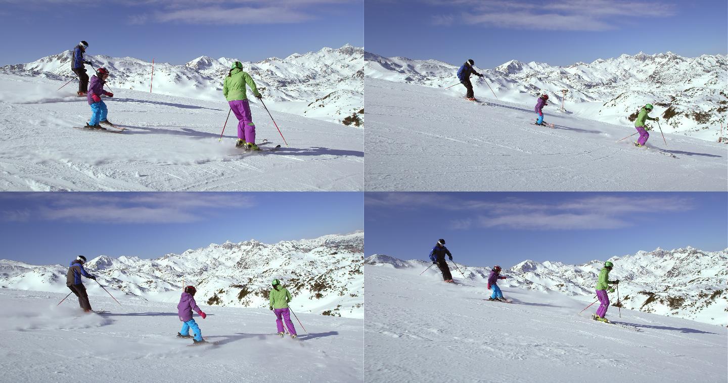 爸爸妈妈教他们的女儿滑雪