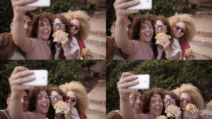 一群朋友吃着汉堡包时的自拍镜头