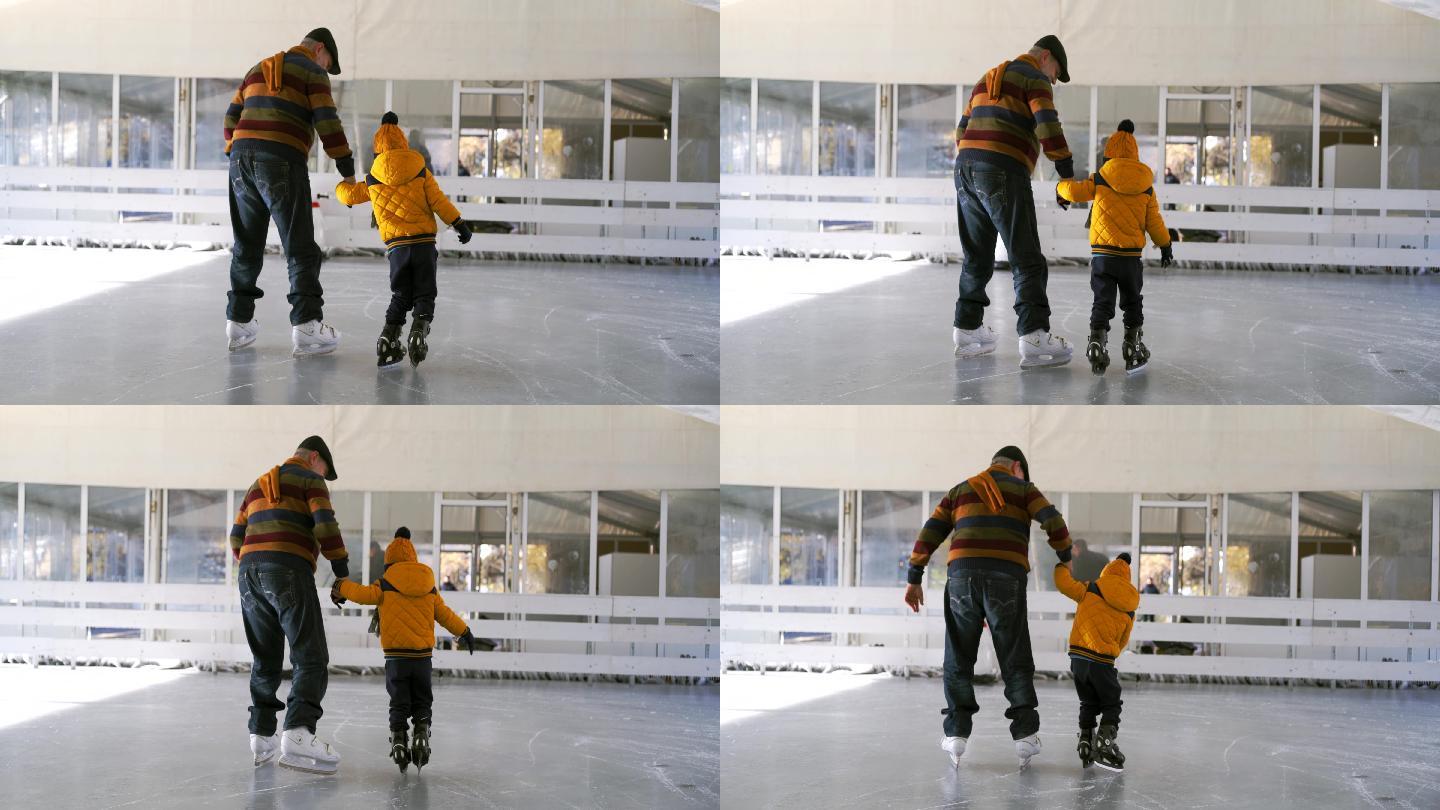 爷爷和孙子在溜冰场滑冰