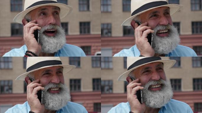 大胡子白发男子在电话中讲话