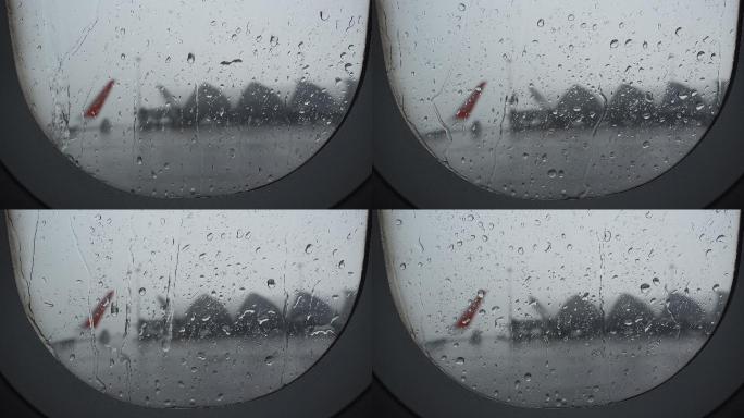 从机场视野窗口拍摄的下雨航班延误