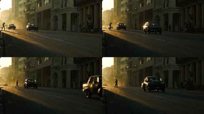 哈瓦那夕阳下的行人和名车