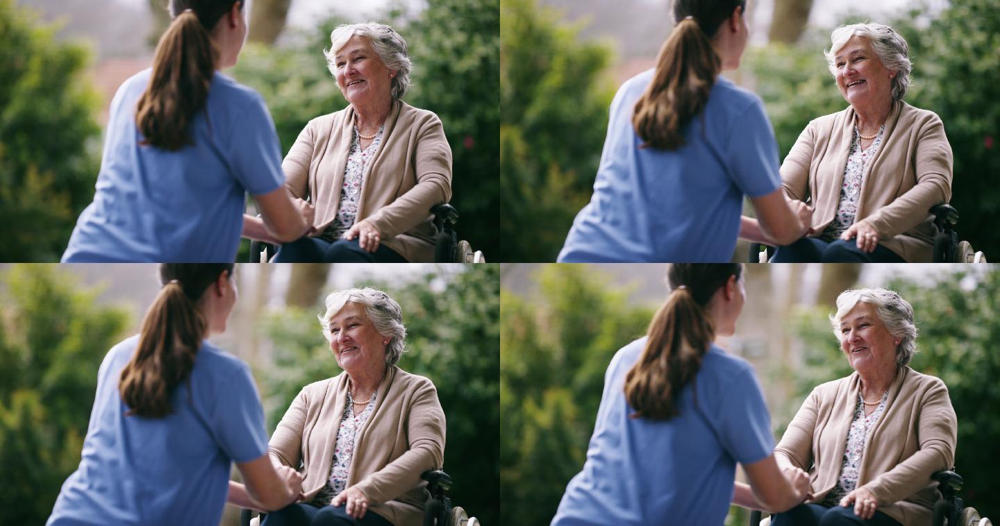 一位老妇人和她的看护人在户外聊天