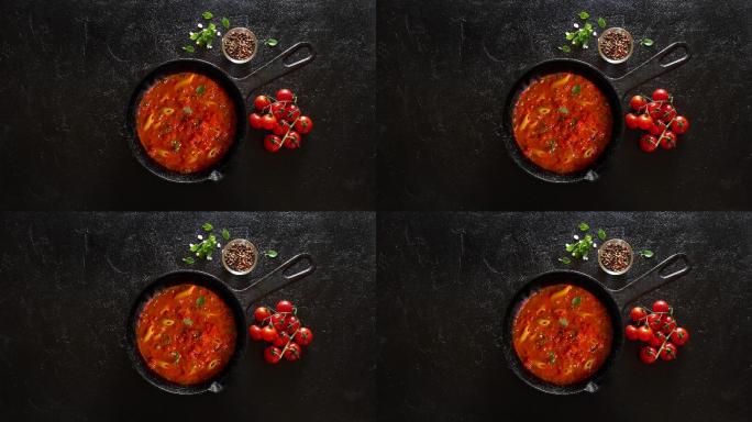 在铁锅上用番茄酱和罗勒煮意大利面